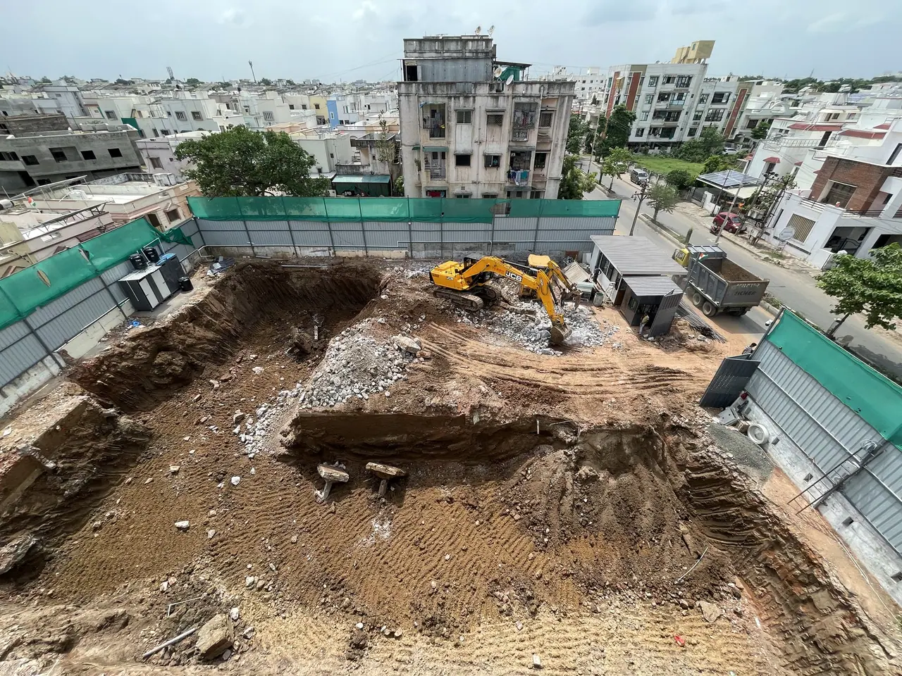 Excavators working in the Shreeji Avenue basement pit