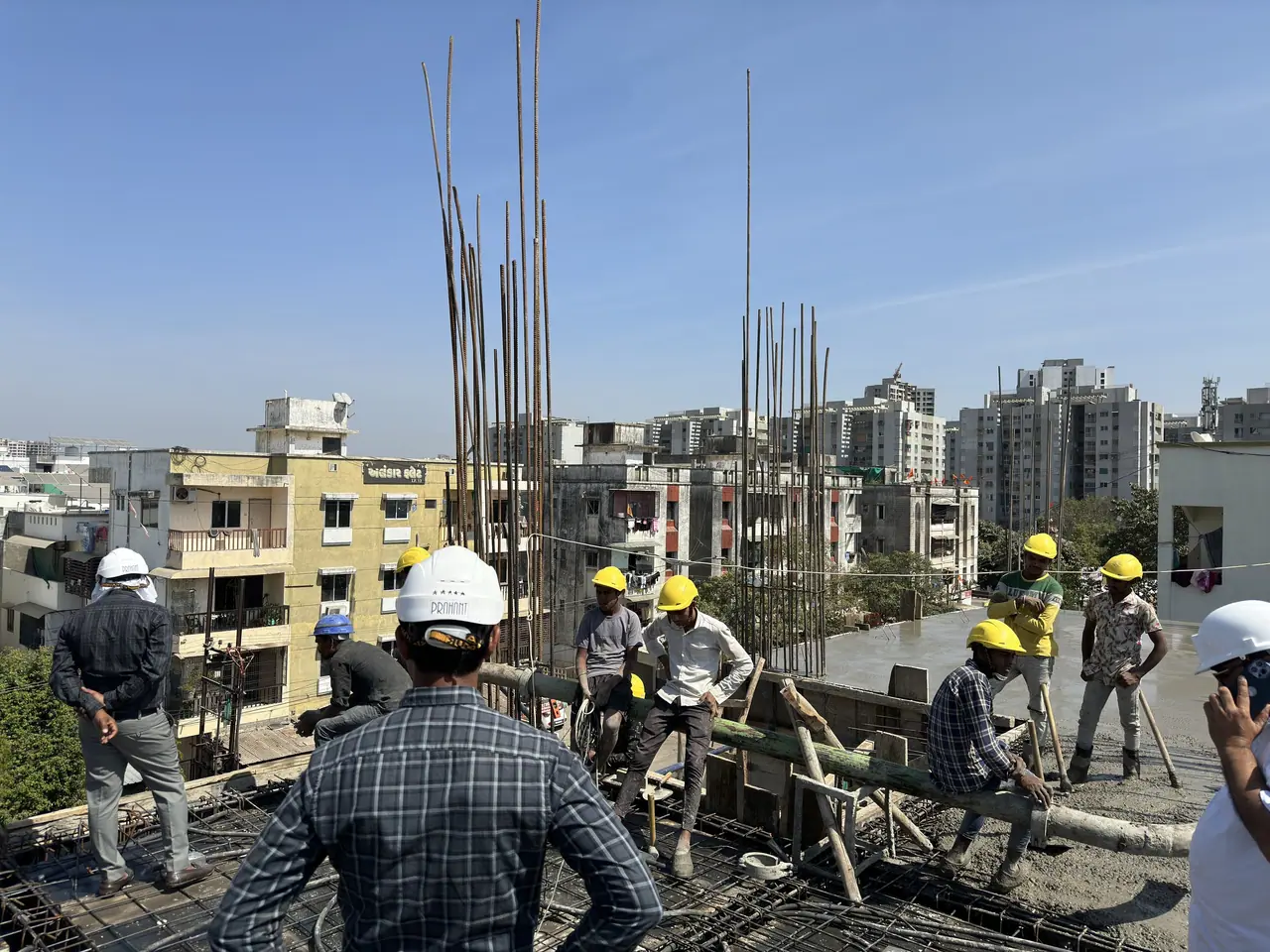 Prahant engineers supervising a slab pour with the site crew