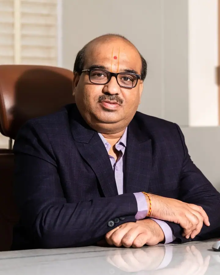 Portrait of Yogesh Soni seated at his desk