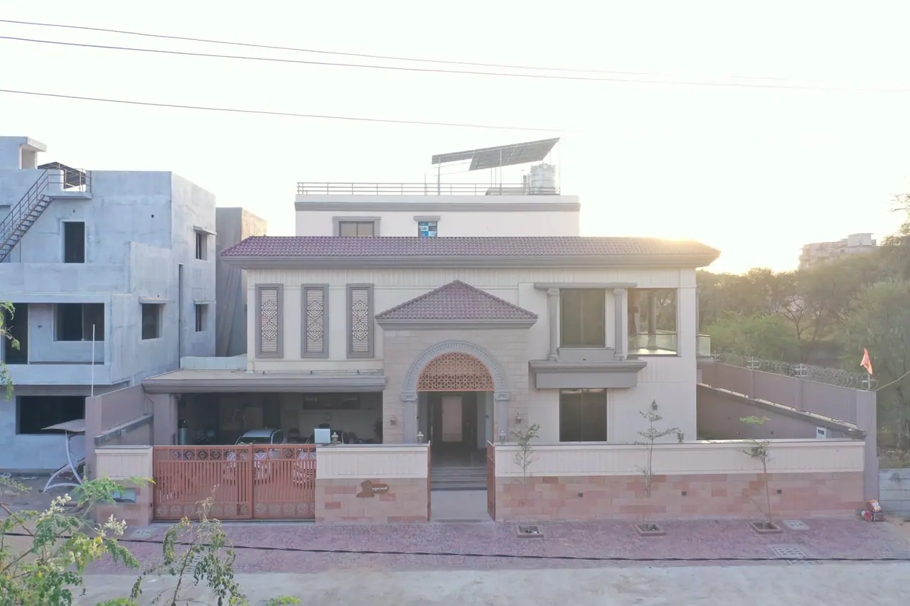 Front elevation of the finished PS Bungalow with its arched entrance and tiled roofs