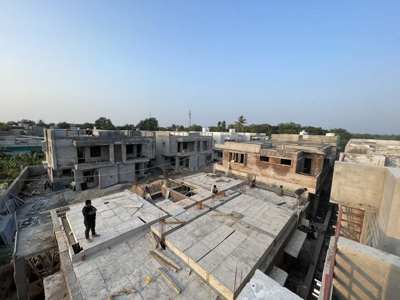 Roof slabs being cast across the Shreeji Vandan row houses